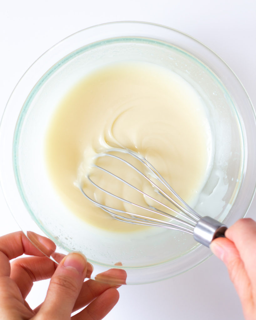 melting the white chocolate for a homemade zebra cakes recipe