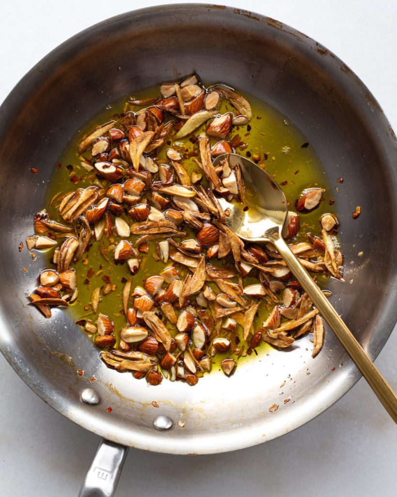 fried garlic and toasted almonds in pan