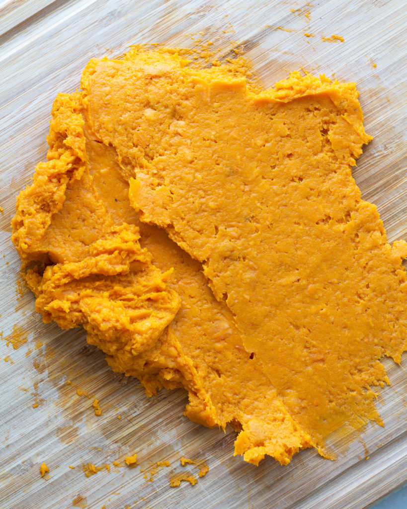 Cooked sweet potato on cutting board