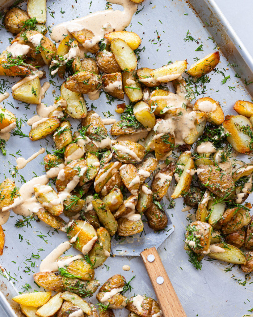 White harissa drizzled on potatoes