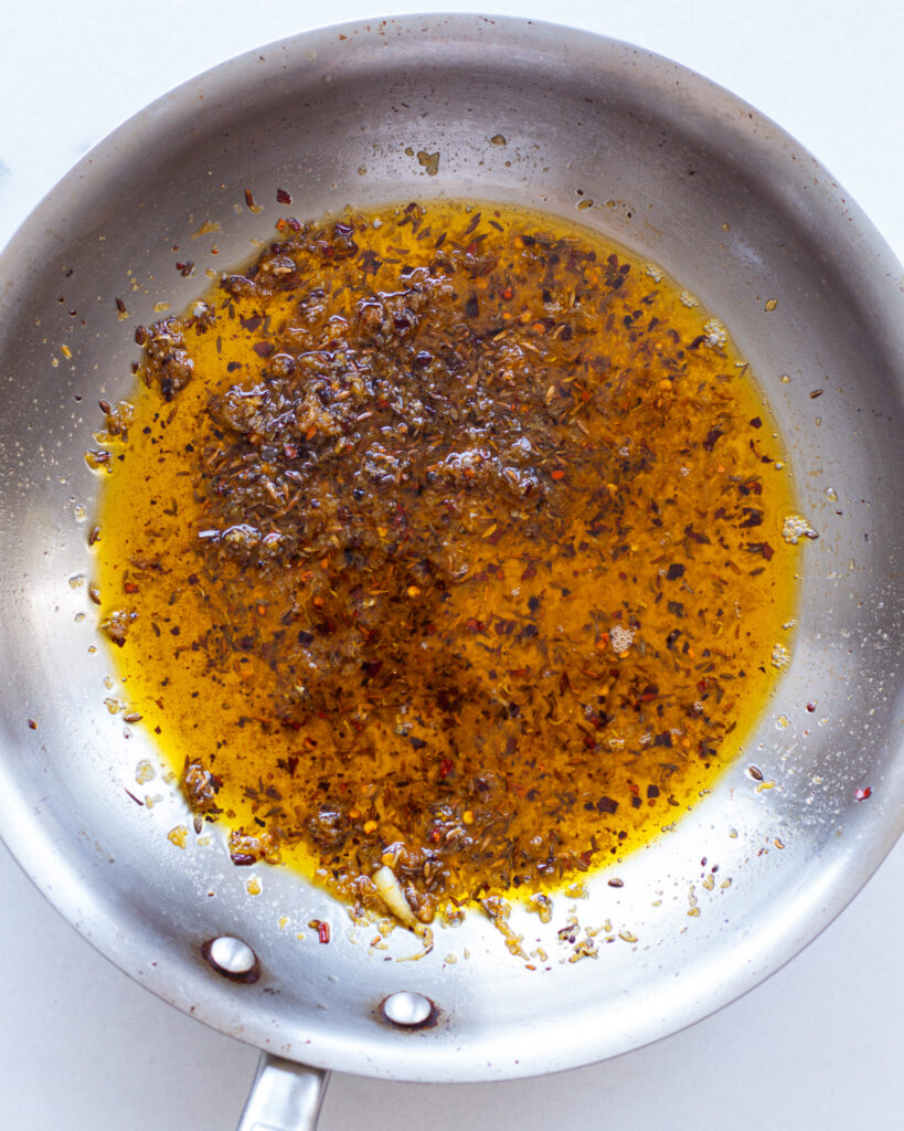White harissa seasonings with oil in pan