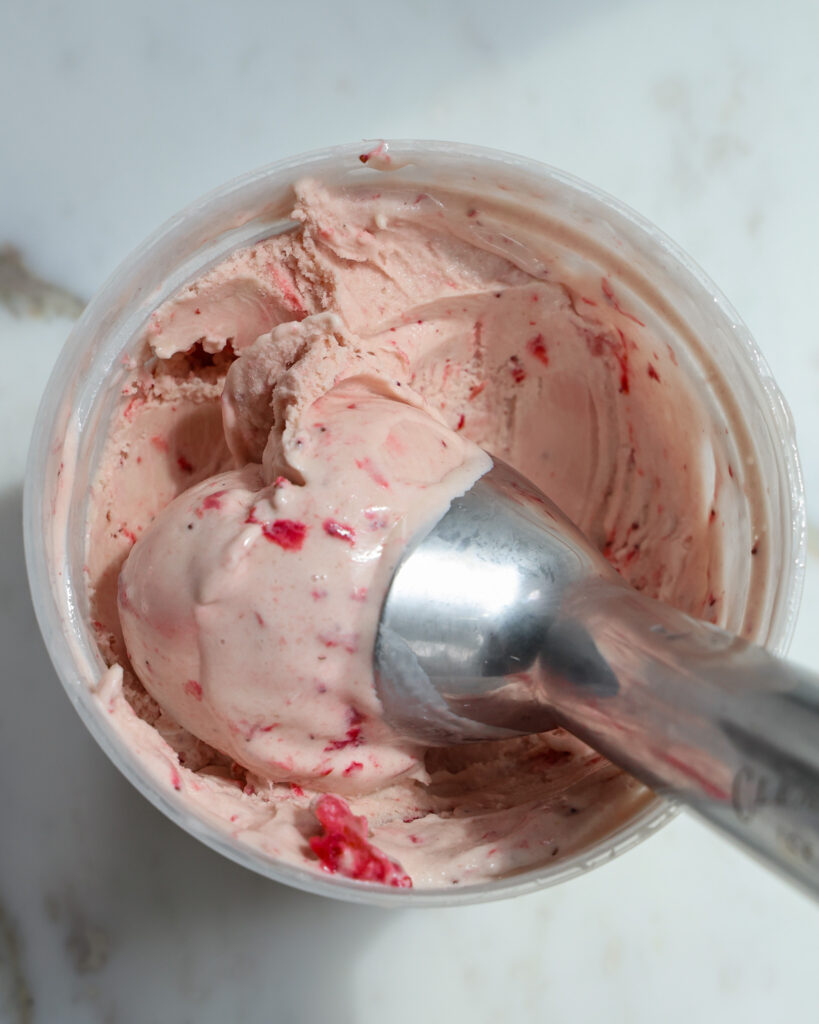 strawberry ice cream being scooped