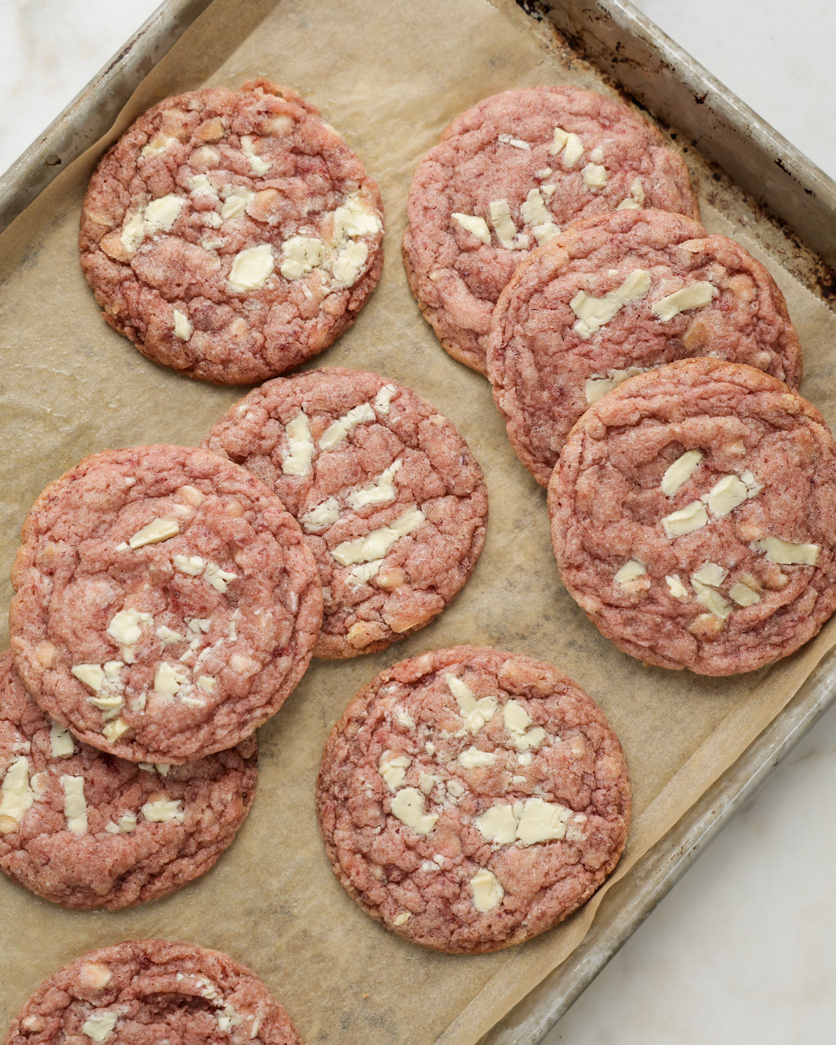 baked strawberry cookies on a baking sheet.
